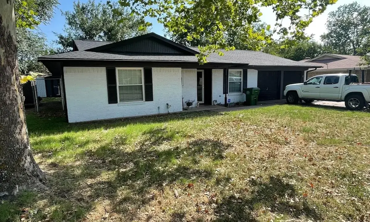 Professional roofing crew working on a residential roof in Prospect